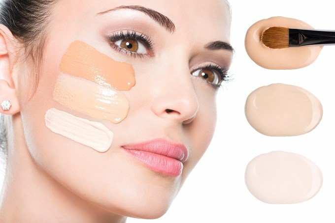Model face of beautiful woman with foundation on skin make-up cosmetics .